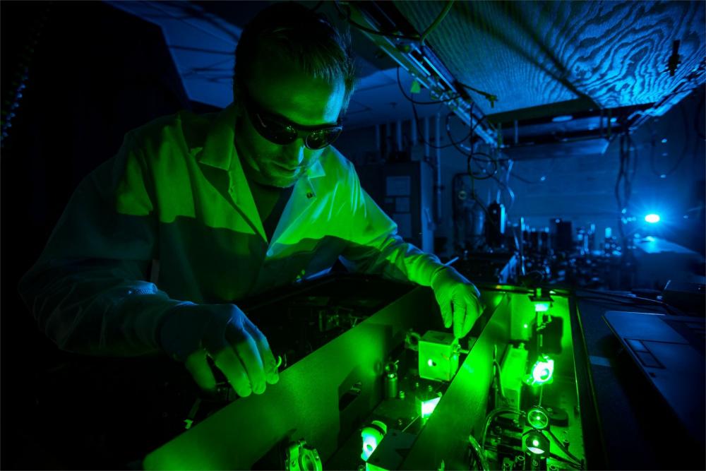 Chemistry student handles equipment in Temple's Borguet Lab.