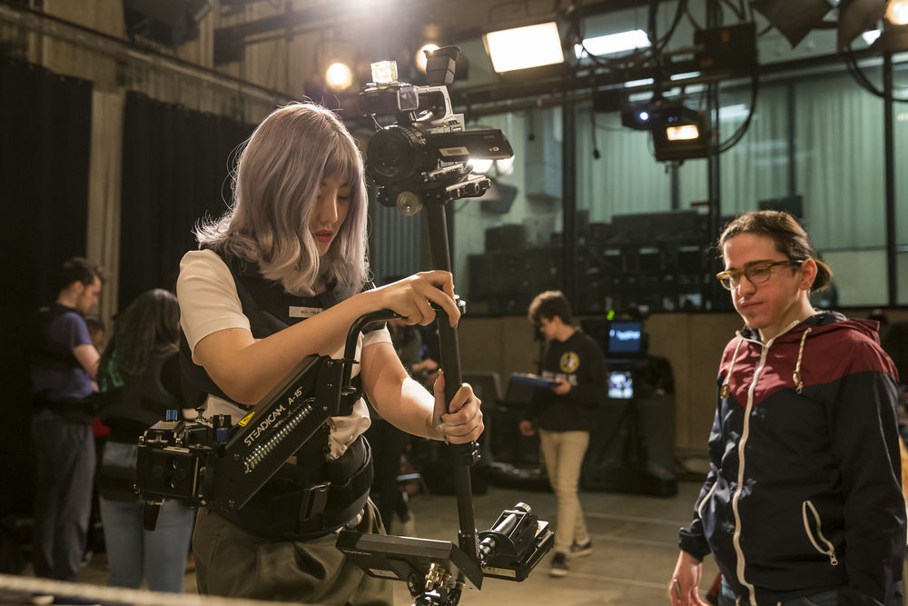 Student operating a Steadicam in a media arts class. 