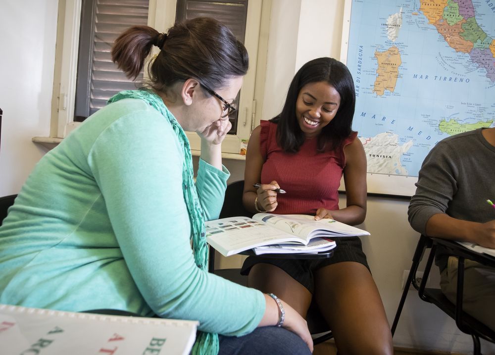 Two students engaging in a foreign language class at Temple University.