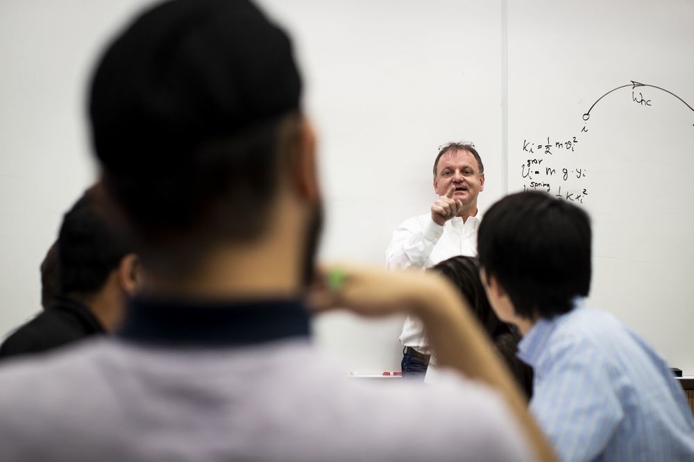 Physics professor lecturing to an undergraduate class