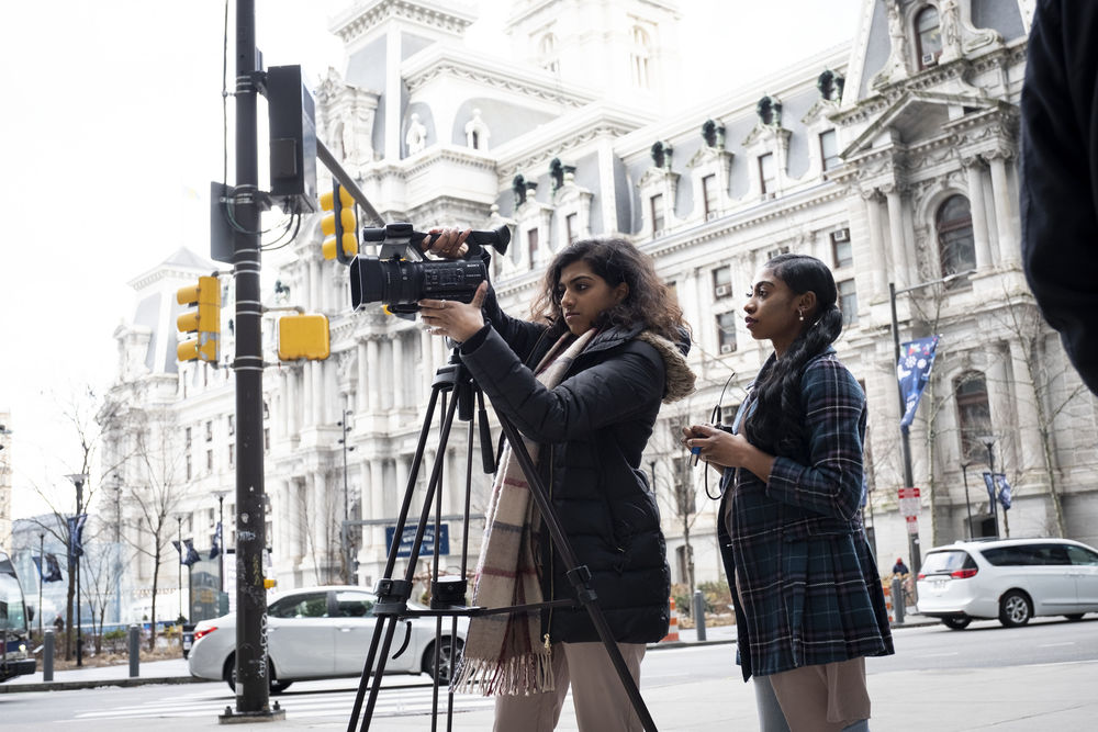 Journalism students setting up a shoot at Philadelphia City Hall.