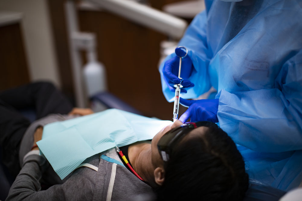 A patient in the Kornberg School of Dentistry receiving periodontics work. 