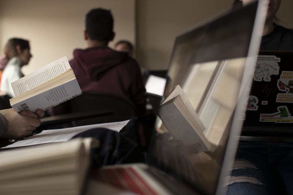 Students reading books in a classroom at Temple University