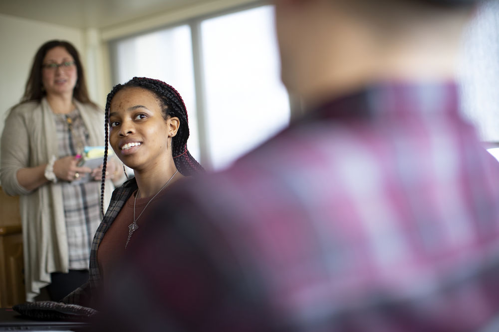 Students interact in a classroom at Temple University.