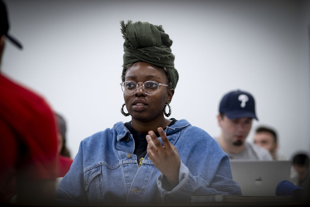 Student engaging in a discussion during an advertising course.