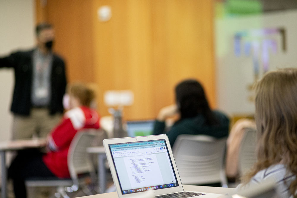 An image of students working on projects in class