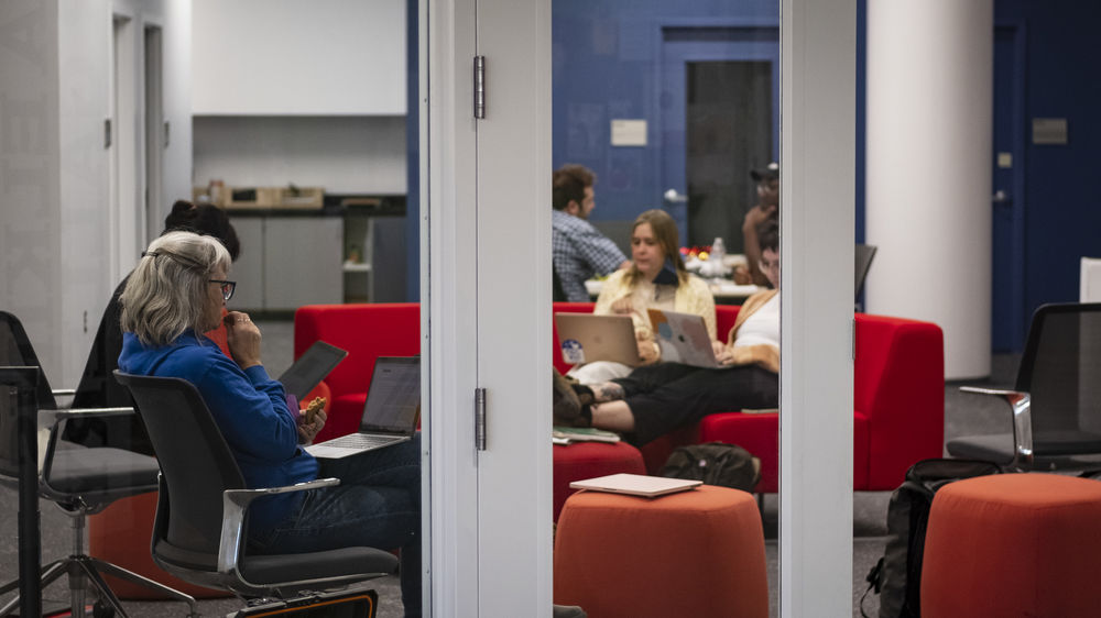 art students study together in a room.