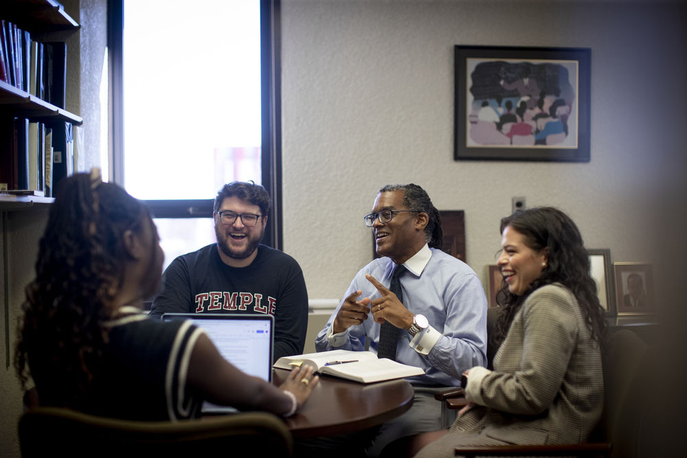 Law students and their professor discuss class topics.