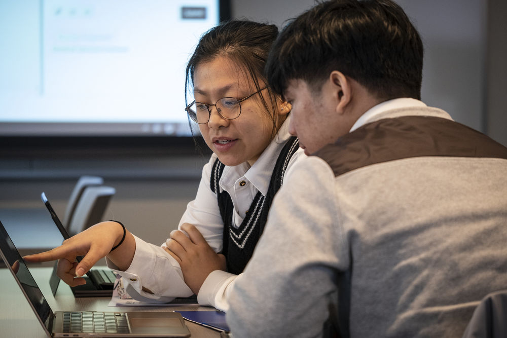 Two Fox students collaborating on an assignment.