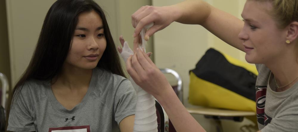 Athletic training students working together in class