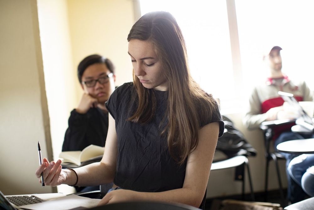 Temple students follow along closely during class discussion.