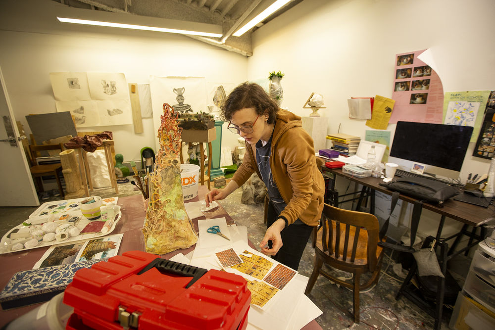 student works on their ceramics project in the studio.