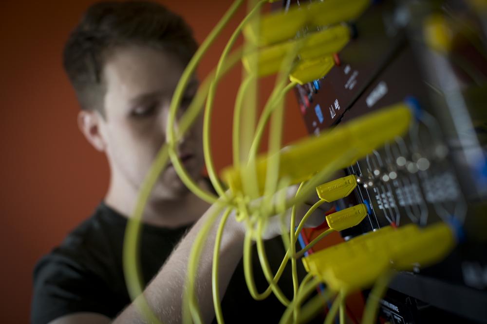 Electrical engineering student working with wiring