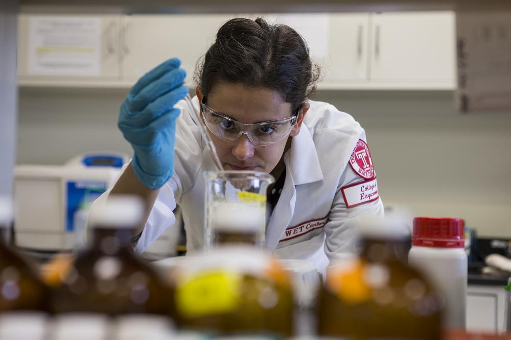 Environmental engineer conducting research study in a lab