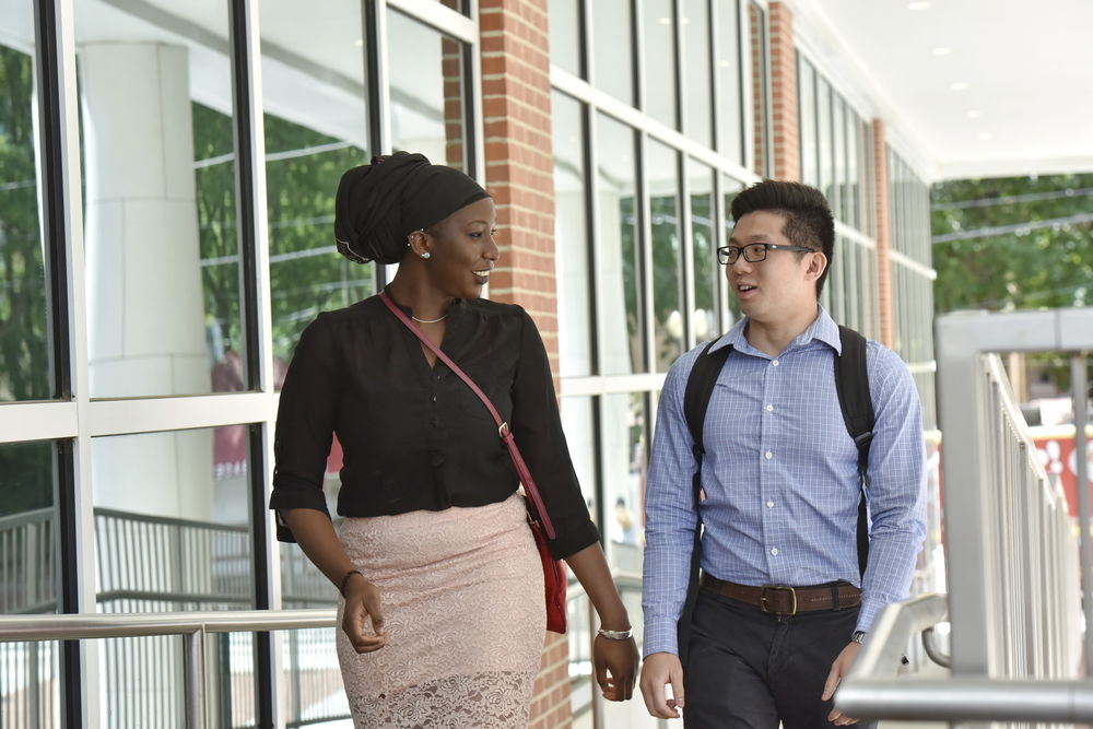 A Fox student discusses an assignment with a professor.