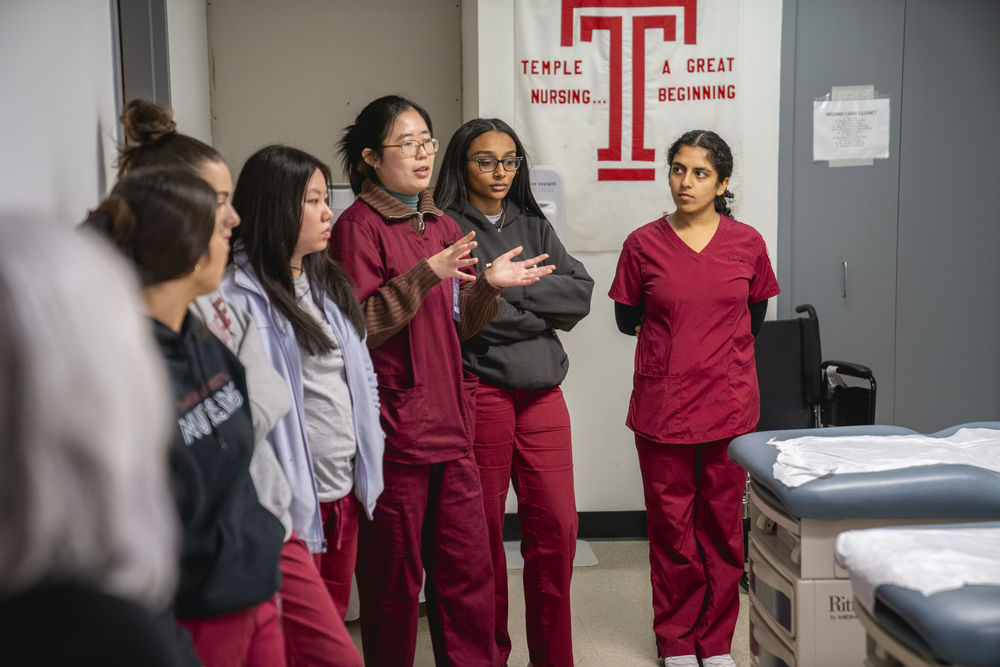 nursing students observe during a simulation.