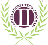 A green and purple logo for the Commission on Accreditation for Health Informatics and Information Management Education.