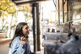 image of Ruthie Freer speaking with food truck operators. 