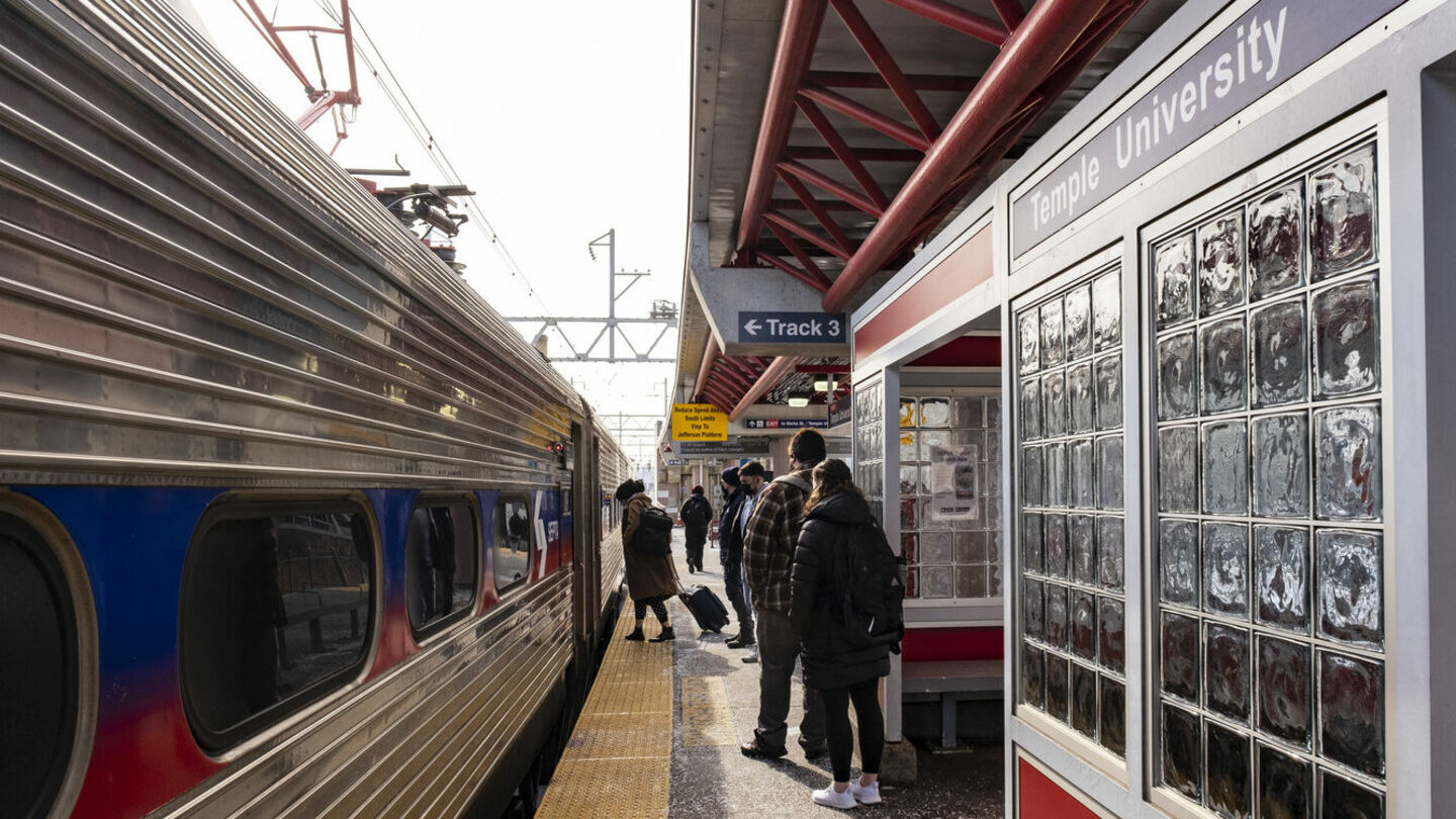 People boarding SEPTA Regional Rail at the Temple University station