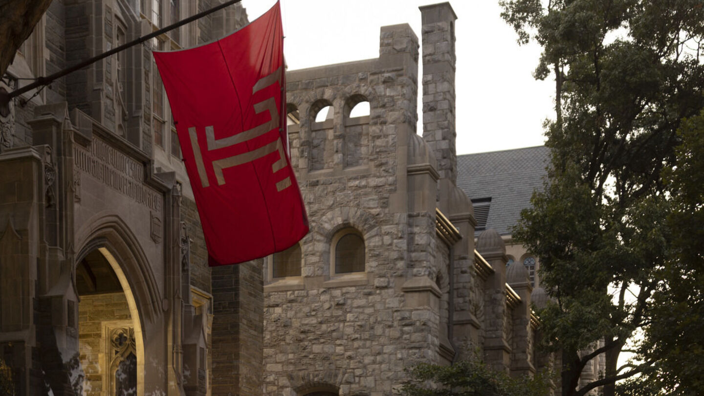 The Temple flag flying outside on Main Campus